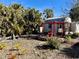 Charming backyard with shed, pergola, and tropical landscaping at 22398 Walton Ave, Port Charlotte, FL 33952