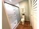 Updated bathroom with a walk-in shower and toilet at 22398 Walton Ave, Port Charlotte, FL 33952