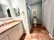Bathroom with shower, toilet, and updated vanity at 22398 Walton Ave, Port Charlotte, FL 33952