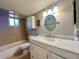 Bathroom with a bathtub, toilet and vanity at 22398 Walton Ave, Port Charlotte, FL 33952