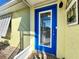 Bright blue front door entryway with stained glass window at 22398 Walton Ave, Port Charlotte, FL 33952