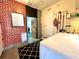 Laundry room with washer, dryer, and painted brick wall at 22398 Walton Ave, Port Charlotte, FL 33952
