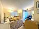 Bright and airy living room with comfy seating and large windows at 22398 Walton Ave, Port Charlotte, FL 33952