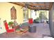 Relaxing covered patio with fire pit and comfortable seating at 22398 Walton Ave, Port Charlotte, FL 33952