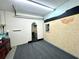 Studio room with mirror and painted brick wall at 22398 Walton Ave, Port Charlotte, FL 33952