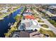 Waterfront homes with boats docked along the canal and a screen enclosed pool at 2240 Via Esplanade, Punta Gorda, FL 33950