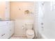 Bathroom with a toilet, shower and white cabinets at 2240 Via Esplanade, Punta Gorda, FL 33950