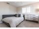 This bedroom features a bed, a dresser, a ceiling fan, and a gray color palette at 2240 Via Esplanade, Punta Gorda, FL 33950