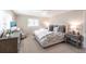 Bedroom with a large bed, dresser, tv, neutral colored walls and carpet at 2240 Via Esplanade, Punta Gorda, FL 33950