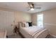 This is a calm bedroom featuring a ceiling fan, neutral walls, and an inviting bed at 2240 Via Esplanade, Punta Gorda, FL 33950