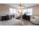 Bedroom with a bed, desk, ceiling fan, and lots of natural light from the windows at 2240 Via Esplanade, Punta Gorda, FL 33950