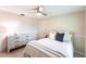 Comfortable bedroom with dresser, a plush bed, and a ceiling fan for optimal air circulation at 2240 Via Esplanade, Punta Gorda, FL 33950