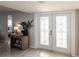 Bright foyer with tile flooring and decorative glass double doors at 2240 Via Esplanade, Punta Gorda, FL 33950