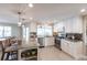 Bright kitchen with white cabinets, tile backsplash, granite countertops, and stainless steel appliances at 2240 Via Esplanade, Punta Gorda, FL 33950