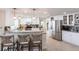 Bright kitchen with white cabinets, tile backsplash, granite countertops, and stainless steel appliances at 2240 Via Esplanade, Punta Gorda, FL 33950