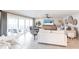 Bright living room with tile floors, sliding glass doors to the lanai, and modern furnishings at 2240 Via Esplanade, Punta Gorda, FL 33950