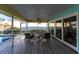 Inviting screened patio with comfortable seating and a view of the backyard and pool at 2240 Via Esplanade, Punta Gorda, FL 33950