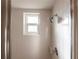 Clean shower featuring a chrome shower head and a small window for ventilation at 2240 Via Esplanade, Punta Gorda, FL 33950