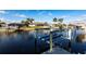 Waterfront view with boat lift and homes at 2240 Via Esplanade, Punta Gorda, FL 33950