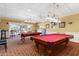 Billiard room featuring two well-maintained pool tables, perfect for friendly competition and recreation at 24509 Bramhope Ct, Punta Gorda, FL 33980