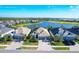 Aerial view of homes near a lake and golf course at 25228 Longmeadow Dr, Punta Gorda, FL 33955
