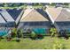 Aerial view of a home with a pool and screened enclosure at 25228 Longmeadow Dr, Punta Gorda, FL 33955