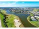 Aerial view of golf course and surrounding neighborhood at 25228 Longmeadow Dr, Punta Gorda, FL 33955