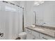 Clean bathroom with a single vanity and shower/tub combo at 25228 Longmeadow Dr, Punta Gorda, FL 33955