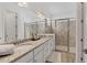 Elegant bathroom with double vanity and a large shower at 25228 Longmeadow Dr, Punta Gorda, FL 33955