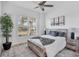 Cozy bedroom with a wooden bed frame and large window at 25228 Longmeadow Dr, Punta Gorda, FL 33955