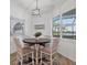 Charming breakfast nook with a wooden table and view to the backyard at 25228 Longmeadow Dr, Punta Gorda, FL 33955