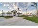 Community clubhouse with palm trees and landscaping at 25228 Longmeadow Dr, Punta Gorda, FL 33955