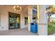 Modern clubhouse entrance with rocking chairs and blue trash can at 25228 Longmeadow Dr, Punta Gorda, FL 33955