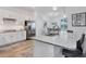 Island kitchen features granite countertops and stainless steel appliances at 25228 Longmeadow Dr, Punta Gorda, FL 33955