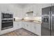 Bright kitchen with stainless steel appliances and granite countertops at 25228 Longmeadow Dr, Punta Gorda, FL 33955