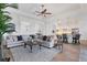 Open living room, kitchen and dining area with sectional sofa at 25228 Longmeadow Dr, Punta Gorda, FL 33955