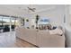 Living room with sectional sofa and sliding doors to lanai at 25228 Longmeadow Dr, Punta Gorda, FL 33955