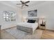 Spacious main bedroom with a large bed and ceiling fan at 25228 Longmeadow Dr, Punta Gorda, FL 33955