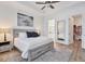 Main bedroom features a large bed, walk-in closet and ensuite bathroom at 25228 Longmeadow Dr, Punta Gorda, FL 33955