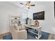 Home office features a desk, chair, shelving, and large artwork at 25228 Longmeadow Dr, Punta Gorda, FL 33955