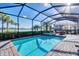 Luxury screened pool and spa with lake view at 25228 Longmeadow Dr, Punta Gorda, FL 33955