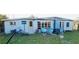 Backyard view showing patio furniture and a trike at 2544 Elkcam Blvd, Port Charlotte, FL 33952