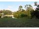 Peaceful backyard with pond and lush landscaping at 2544 Elkcam Blvd, Port Charlotte, FL 33952
