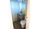 Clean bathroom with gray vanity and a toilet at 2544 Elkcam Blvd, Port Charlotte, FL 33952