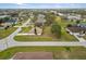 Aerial view showing a single-Gathering house and surrounding homes in a neighborhood at 26108 Paysandu Dr, Punta Gorda, FL 33983