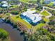 Stunning aerial shot of a home with a pool, private dock, lush greenery and waterfront views at 27320 Egret Pl, Punta Gorda, FL 33983