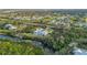 Gorgeous aerial view of a waterfront home with a private dock and an inviting backyard pool at 27320 Egret Pl, Punta Gorda, FL 33983