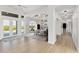 Bright dining room with modern decor, tray ceiling, wood floors and views of the pool at 27320 Egret Pl, Punta Gorda, FL 33983