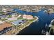 Aerial view of home with pool and canal access at 2807 Sancho Panza Ct, Punta Gorda, FL 33950