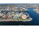 Aerial view of waterfront home with private dock and pool at 2807 Sancho Panza Ct, Punta Gorda, FL 33950